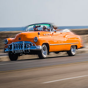 Old American Car in Havana's Seawall Promenade, Cuba Tourism Industry